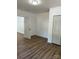 Spacious bedroom with wood-look vinyl flooring and double door closet at 115 Palmer St, Shelby, NC 28150