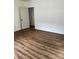 Spacious bedroom featuring laminate wood flooring at 115 Palmer St, Shelby, NC 28150