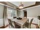 Formal dining room with wood table and chairs, and access to kitchen at 8714 Brideswell Ln, Charlotte, NC 28278
