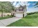 Two story house with landscaping and driveway at 8714 Brideswell Ln, Charlotte, NC 28278