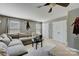 Gathering room with sectional sofa and large windows at 8714 Brideswell Ln, Charlotte, NC 28278
