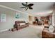 Open living room features hardwood floors and a view into the kitchen at 8714 Brideswell Ln, Charlotte, NC 28278
