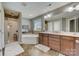 Double vanity bathroom with corner soaking tub and shower at 8714 Brideswell Ln, Charlotte, NC 28278