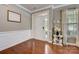 Entryway with hardwood floors and white trim at 8714 Brideswell Ln, Charlotte, NC 28278