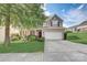 Two story house with landscaping and driveway at 8714 Brideswell Ln, Charlotte, NC 28278