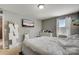 Bedroom with a TV and white dresser at 8714 Brideswell Ln, Charlotte, NC 28278