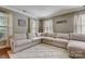 Spacious living room with large sectional sofa at 8714 Brideswell Ln, Charlotte, NC 28278