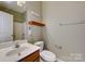 Simple bathroom with a single vanity and toilet at 8714 Brideswell Ln, Charlotte, NC 28278