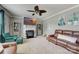 Gathering room with fireplace, large TV, and comfortable seating area at 8714 Brideswell Ln, Charlotte, NC 28278