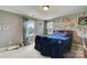 Bedroom with a unique wall decor and a full-size bed at 8714 Brideswell Ln, Charlotte, NC 28278