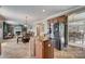 Kitchen features island, stainless steel appliances, and view to Gathering room at 8714 Brideswell Ln, Charlotte, NC 28278