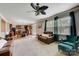 Open concept Gathering room with kitchen view and comfortable seating at 8714 Brideswell Ln, Charlotte, NC 28278