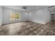 Living room with wood-look flooring and access to kitchen at 1135 River Trace Ln, Salisbury, NC 28144