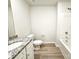 Bathroom with granite countertop vanity, toilet, and bathtub at 414 Apex Cir, Shelby, NC 28152