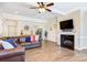 Spacious living room featuring a fireplace, hardwood floors, and comfortable leather sofas at 4198 Pickering Dr, Hickory, NC 28602