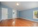 Bedroom with hardwood floors, blue walls and en-suite bathroom at 149 Pine Hollow Dr, Dallas, NC 28034