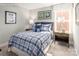 bedroom with plaid bedding and soccer decor at 1979 Tupelo Grove Ln, Gastonia, NC 28054