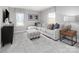 Relaxing living area with sectional sofa and ottoman at 1979 Tupelo Grove Ln, Gastonia, NC 28054