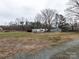Open land with horse trailer and house visible at 12560 Highway 601 Hwy, Midland, NC 28107