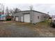 Large metal workshop with two garage doors and ample parking at 12560 Highway 601 Hwy, Midland, NC 28107