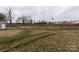 Vacant land with tire tracks near a workshop at 12560 Highway 601 Hwy, Midland, NC 28107
