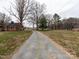 Long gravel driveway leading to two homes at 12560 Highway 601 Hwy, Midland, NC 28107