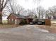 Brick house with carport and gravel driveway at 12560 Highway 601 Hwy, Midland, NC 28107