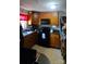 Kitchen with wood cabinets, black appliances, and tile floor at 2210 Goldmine Rd, Monroe, NC 28110