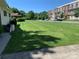 Neatly landscaped yard with a view of townhouses at 9400 Sandburg Ave, Charlotte, NC 28213