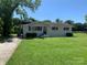 Simple one-story home with a small front yard at 9400 Sandburg Ave, Charlotte, NC 28213