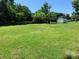 Large backyard with two sheds and a fenced area at 9400 Sandburg Ave, Charlotte, NC 28213