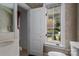 Clean bathroom with marble vanity and a window overlooking the garden at 179 Appian Way, Shelby, NC 28150