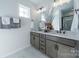 Elegant bathroom with double vanity and marble flooring at 5919 Wetlands Aly, Charlotte, NC 28215