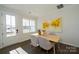 Light-filled dining area with wood table and modern chairs, near entrance at 5919 Wetlands Aly, Charlotte, NC 28215