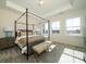 Spacious main bedroom with a canopy bed and ample natural light at 5919 Wetlands Aly, Charlotte, NC 28215