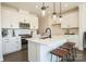Modern kitchen with white cabinets, quartz countertops, and island at 5919 Wetlands Aly, Charlotte, NC 28215