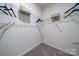 Spacious walk-in closet with wire shelving and hanging rods at 5919 Wetlands Aly, Charlotte, NC 28215