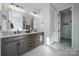 Modern bathroom with double vanity and walk-in shower at 5919 Wetlands Aly, Charlotte, NC 28215