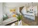 Open living room and kitchen with hardwood floors and neutral colors at 5919 Wetlands Aly, Charlotte, NC 28215