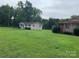 Two houses with large grassy yards at 9408 Sandburg Ave, Charlotte, NC 28213