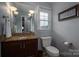 Powder room with granite vanity and updated fixtures at 634 Carson Rd, Gastonia, NC 28052