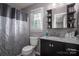 Clean bathroom with shower/tub combo, vanity, and updated fixtures at 634 Carson Rd, Gastonia, NC 28052