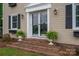 Front entrance with brick steps and elegant landscaping at 634 Carson Rd, Gastonia, NC 28052