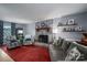 Living room with a brick fireplace and comfy seating at 634 Carson Rd, Gastonia, NC 28052