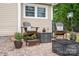 Cozy patio features fire pit, seating, and attractive landscaping at 634 Carson Rd, Gastonia, NC 28052