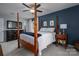 Spacious bedroom with four-poster bed and carpeted floor at 634 Carson Rd, Gastonia, NC 28052