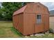 Well-maintained wooden storage shed with red roof at 634 Carson Rd, Gastonia, NC 28052