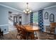 Bright dining room with hardwood floors and a wood table at 634 Carson Rd, Gastonia, NC 28052