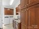 Laundry room with washer, dryer, and ample cabinet space at 909 Shinnville Rd, Mooresville, NC 28115