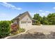 Two-car attached garage and side view of house at 909 Shinnville Rd, Mooresville, NC 28115